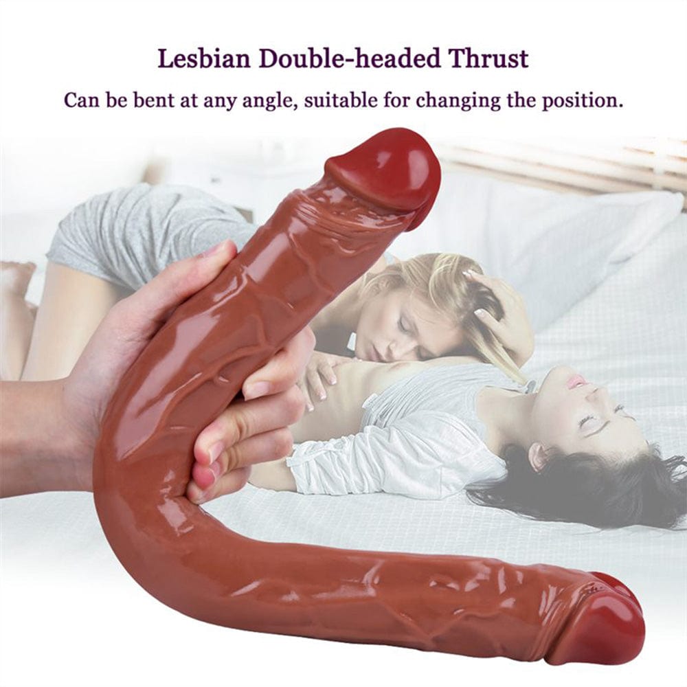 Hand holding bent dildo showing flexibility